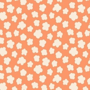 small silhouette flowers cream on orange 