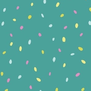 speckles pink yellow green on teal