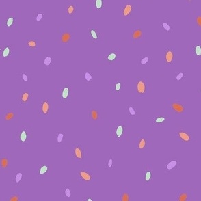 speckles red lilac green on purple