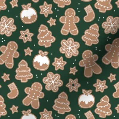 Christmas cookies seasonal baked ginger bread men christmas trees stars snow flakes and pudding cookie dough pine green