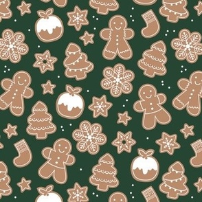 Christmas cookies seasonal baked ginger bread men christmas trees stars snow flakes and pudding cookie dough pine green