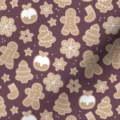 Christmas cookies seasonal baked ginger bread men christmas trees stars snow flakes and pudding cookie dough wine red purple