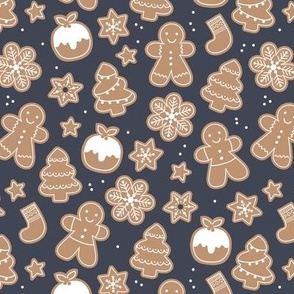Christmas cookies seasonal baked ginger bread men christmas trees stars snow flakes and pudding cookie dough stone blue