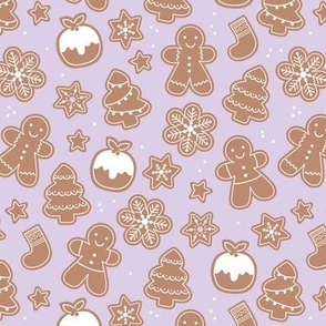 Christmas cookies seasonal baked ginger bread men christmas trees stars snow flakes and pudding cookie dough lilac