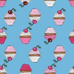 Sweet cupcakes with cherry and whipped cream in rows on sky blue  NON DIRECTIONAL Small scale