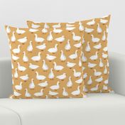 Cute White Puddle Ducks on Mustard Burlap by Brittanylane