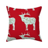 French Script reindeer on red