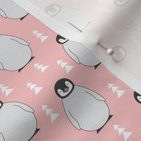 small penguins with triangle trees on soft pink