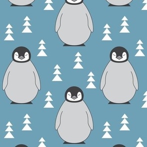large penguins with triangle trees on blue