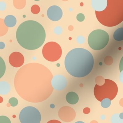 Blue, green, and orange circles on a peach background 