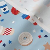 Good morning coffee to go and donuts for breakfast happy 4th of july party confetti and stars design american holiday flag colors red blue on baby blue