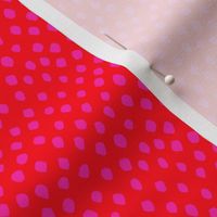 Hot pink spots on red