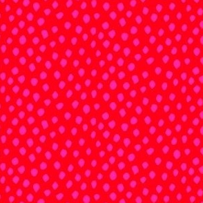 Hot pink spots on red