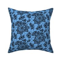 Black lace flower on blue 