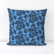 Black lace flower on blue 