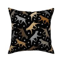 Trotting uncropped Cane Corso and paw prints - black