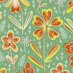 Flowers drawn in chalk, brown and yellow on a green background