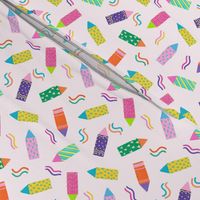 colorful crayon on pink background
