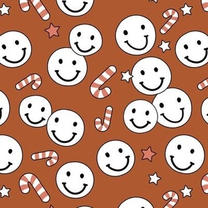 Happy holidays smiley christmas with smileys candy canes and stars retro style seasonal design vintage red on rust 