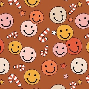 Happy holidays smiley christmas with smileys candy canes and stars retro style seasonal design vintage red pink yellow on rust burnt orange