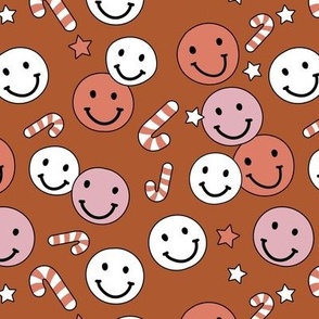 Happy holidays smiley christmas with smileys candy canes and stars retro style seasonal design vintage red pink white on rust burnt orange seventies