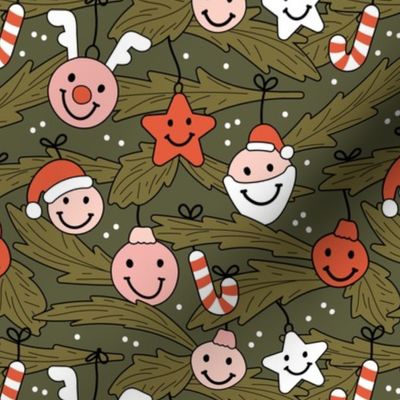 Happy holidays smiley christmas with smileys candy canes mistletoe and tree branches vintage red pink blush on pine green