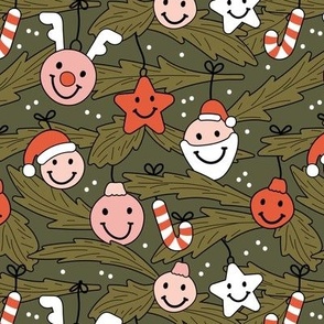 Happy holidays smiley christmas with smileys candy canes mistletoe and tree branches vintage red pink blush on pine green