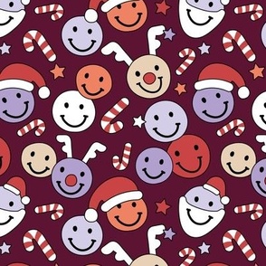 Happy holidays smiley christmas with smileys stars happy santa claus candy cane and reindeer vintage orange red lilac on burgundy