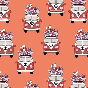 Happy holidays colorful Christmas camper van hippie bus with presents driving home for Christmas vintage orange red lilac