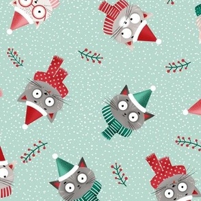 Medium | Christmas cats in red Santa hats and scarfs on green mint background, medium scale