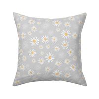 Daisy field on grey large scale