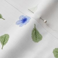 Blue Blossoms-tossed, small blue flowers with falling green leaves on a white background.