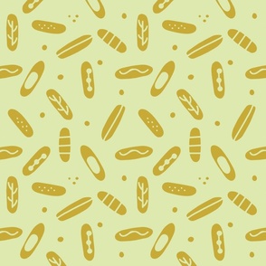 scattered seed pods _light olive green and gold abstract oblong non-directional shapes 