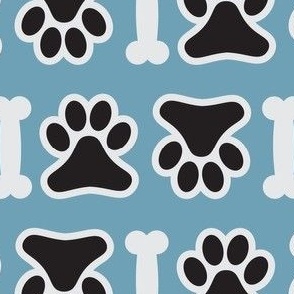 dog paw and bone on blue background