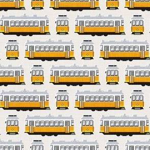 Tiny scale  // Lisbon trams // beige background lemon lime and marigold transport