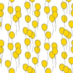 yellow balloons on string