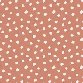 cream dots on coral