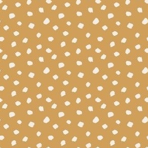 cream dots on golden mustard