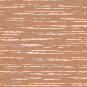 Thin white  horizontal lines on caramel brown