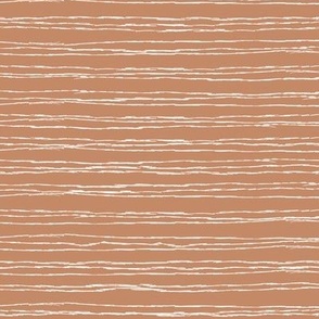 Thin white  horizontal stripes on caramel brown