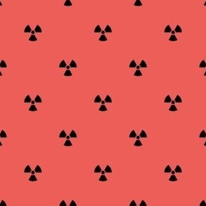 Black Radiation Symbols on a Coral Red Background