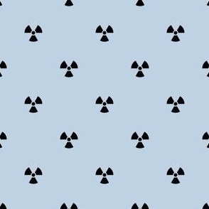 Black Radiation Symbols on a Fog Blue Background