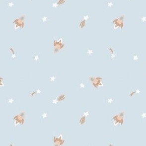 Small neutral rocket ships in outer space with stars for kids in a boho blue