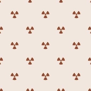 Brown Burnt Sienna Radiation Symbols on an Off White Cement Background
