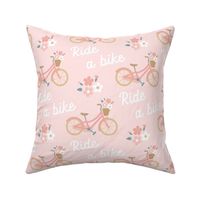 Sweet and cute pink girlie bike with basket of flowers 