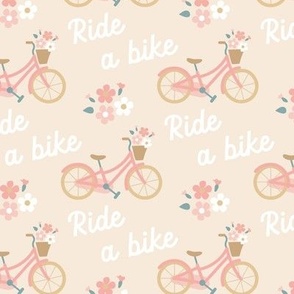 Sweet and cute pink girlie bike with basket of flowers 