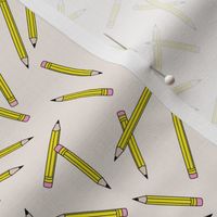 Back to school messy pencils art supply kids design in yellow on cream ivory sand