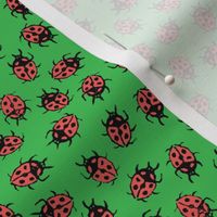 rubberstamped ladybugs on green