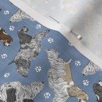 Tiny Trotting parti docked Cocker Spaniels and paw prints - faux denim