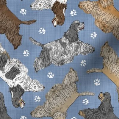 Trotting tailed Cocker Spaniels and paw prints - faux denim